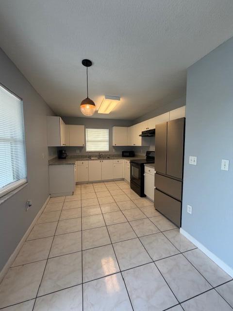3282 Northwest 75th Way Davie, FL 33024 - Photo 3 of 13 a kitchen with stainless steel appliances granite countertop a refrigerator and a stove top oven