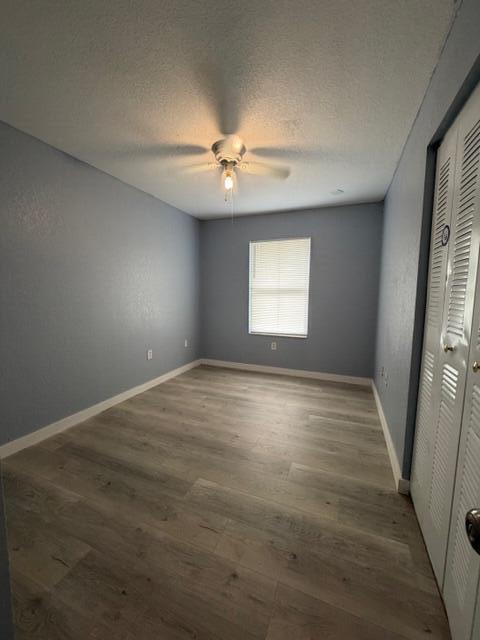 3282 Northwest 75th Way Davie, FL 33024 - Photo 6 of 13 an empty room with windows and ceiling fan