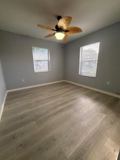 3282 Northwest 75th Way Davie, FL 33024 - Photo 7 of 13 an empty room with a ceiling fan and window