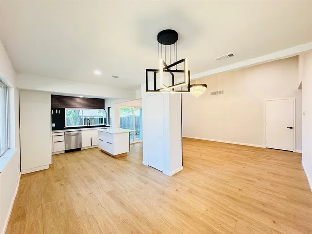 a view of a kitchen with a sink