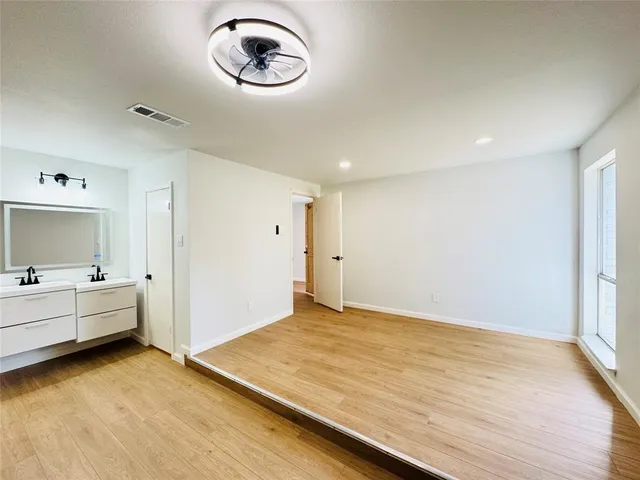 a view of room with equipment and mirror