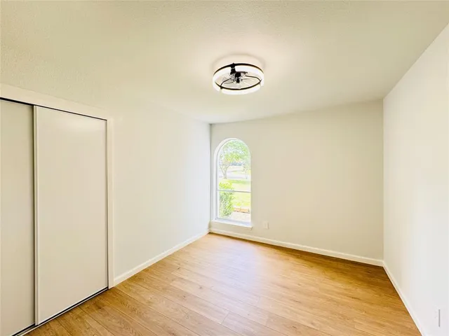 a view of a room with a wooden floor
