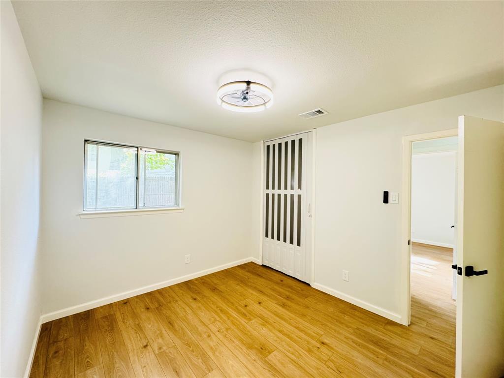 21 Grant Circle Richardson, TX 75081 - Photo 22 of 24 a view of empty room with wooden floor