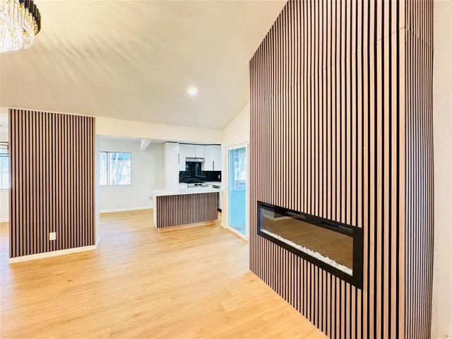 a view of a kitchen with a sink and cabinets