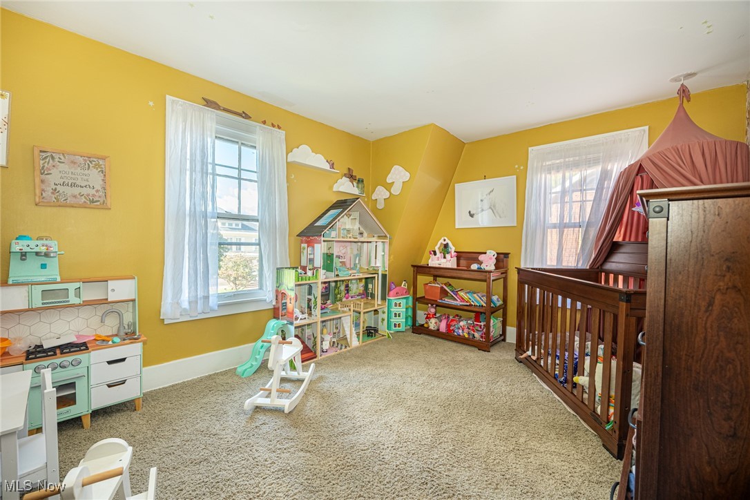 540 Cambridge Road Coshocton, OH 43812 - Photo 16 of 38 Recreation room featuring healthy amount of natural light and carpet floors