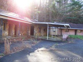 1445 Hwy 176 N Tryon Nc 28782 Tryon, NC 28782 - Photo 4 of 4 a view of a house with a yard