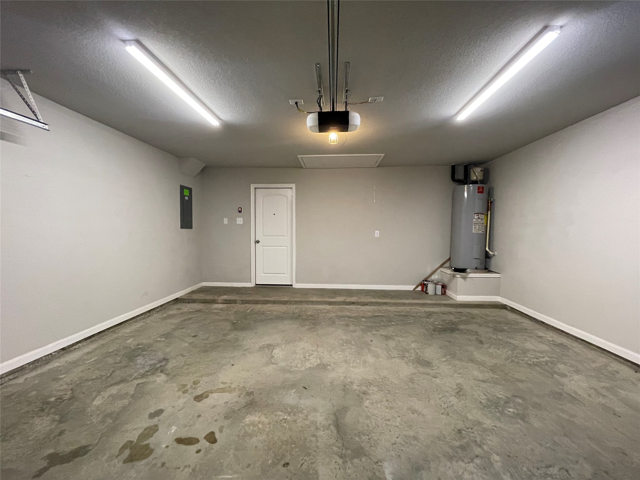 8113 Northgate Loop Temple, TX 76502 - Photo 31 of 35 Spacious garage featuring a concrete floor, painted walls, and overhead lighting