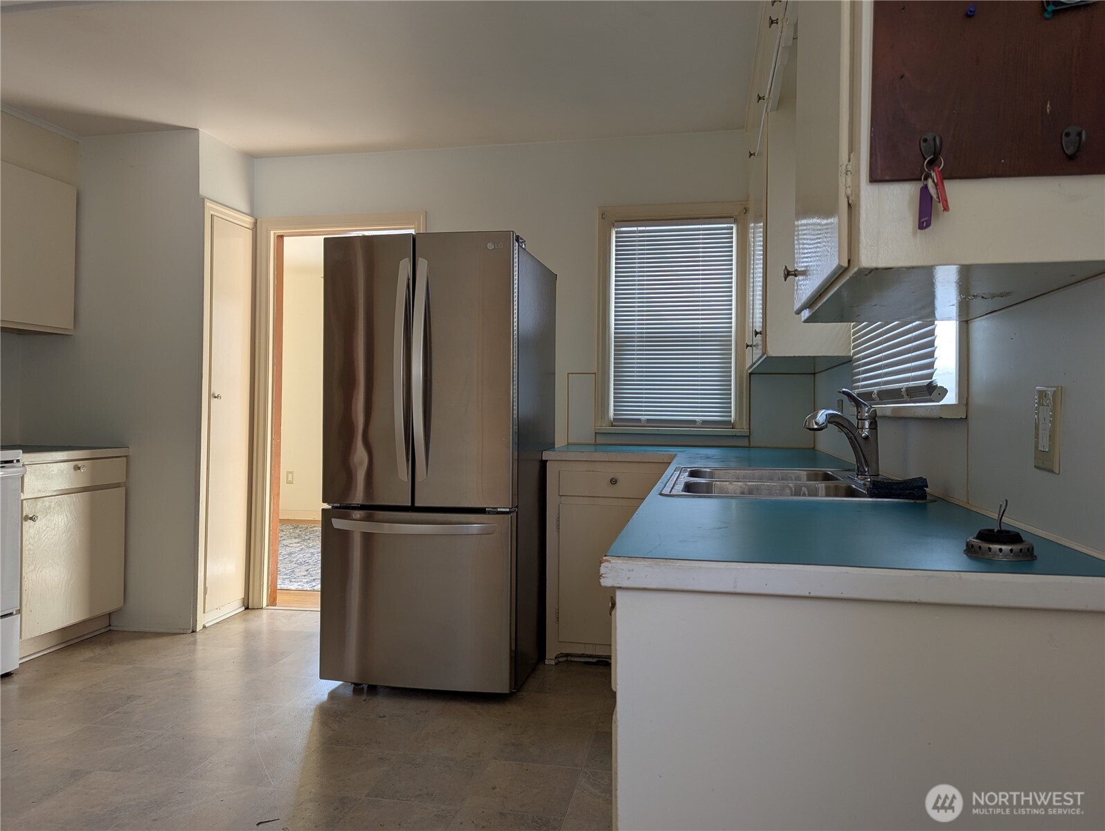 1611 4th Street Marysville, WA 98270 - Photo 2 of 8 a kitchen with stainless steel appliances granite countertop a refrigerator and a sink