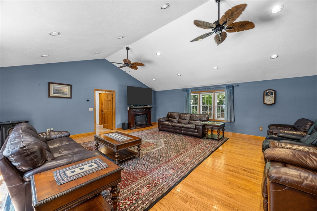 19 King Philip Path Mendon, MA 01756 - Photo 13 of 42 a living room with furniture and a flat screen tv