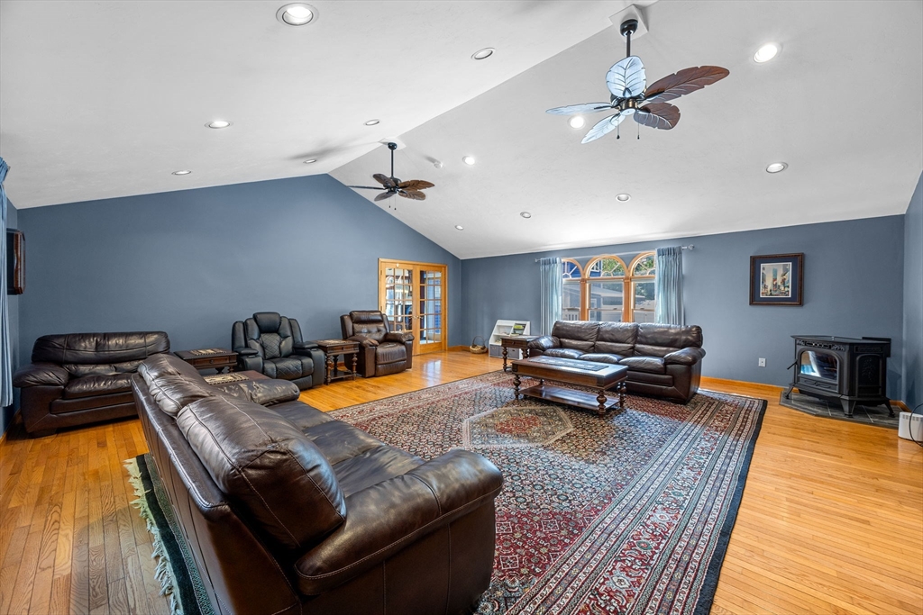 19 King Philip Path Mendon, MA 01756 - Photo 14 of 42 a living room with furniture and a wooden floor