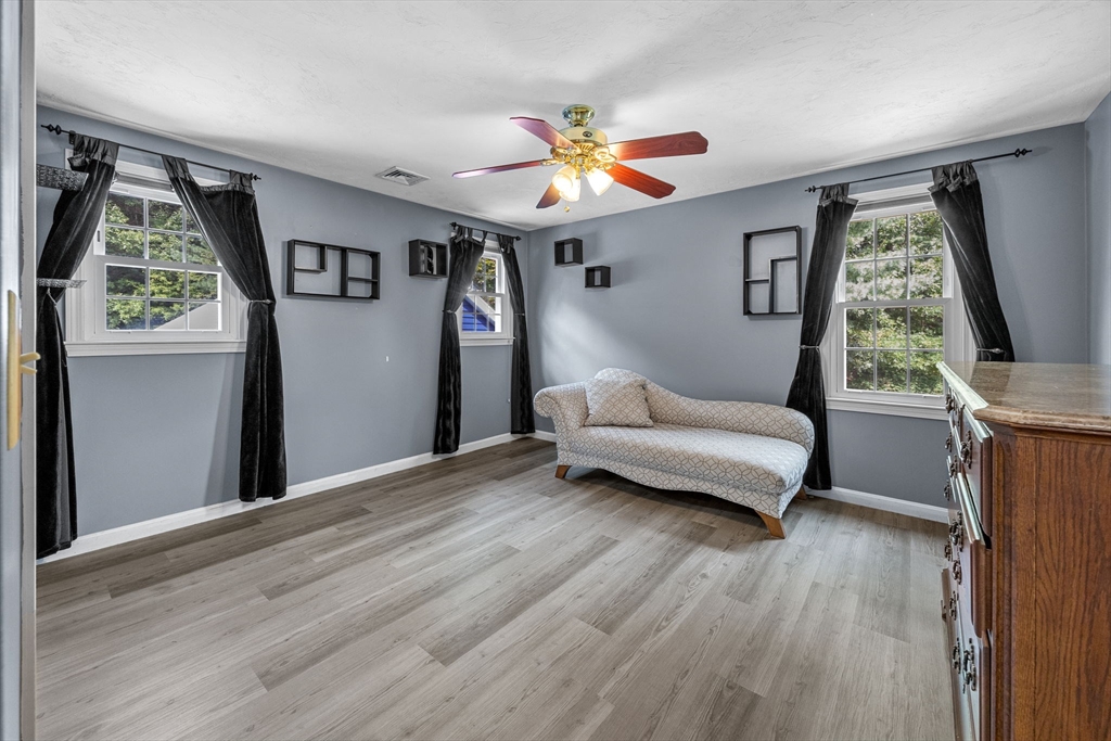 19 King Philip Path Mendon, MA 01756 - Photo 19 of 42 a living room with furniture and a window
