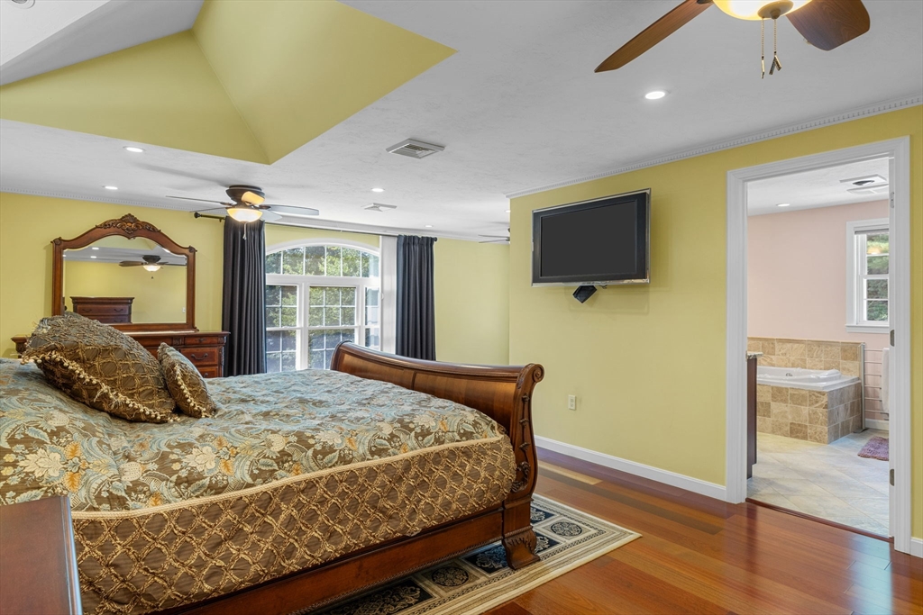 19 King Philip Path Mendon, MA 01756 - Photo 27 of 42 a bedroom with a bed and a flat screen tv