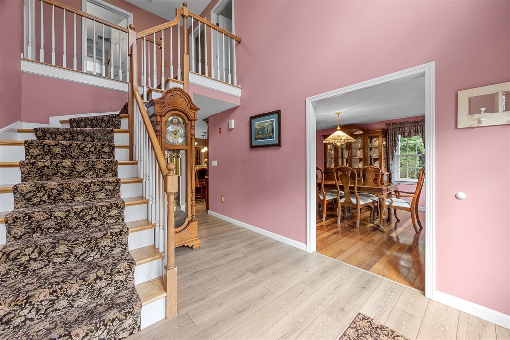 19 King Philip Path Mendon, MA 01756 - Photo 3 of 42 a view of entryway and hall with wooden floor
