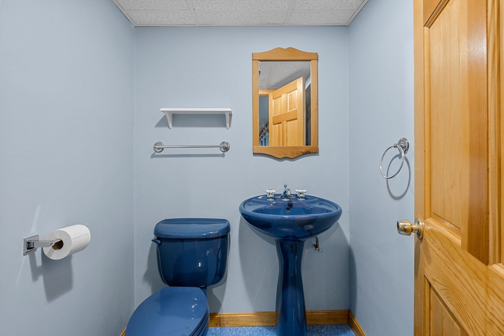 19 King Philip Path Mendon, MA 01756 - Photo 35 of 42 a bathroom with a sink toilet and a mirror