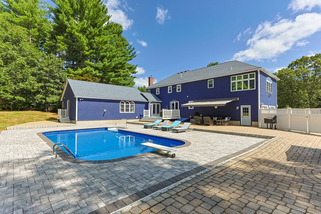 19 King Philip Path Mendon, MA 01756 - Photo 37 of 42 a view of a house with swimming pool and sitting area