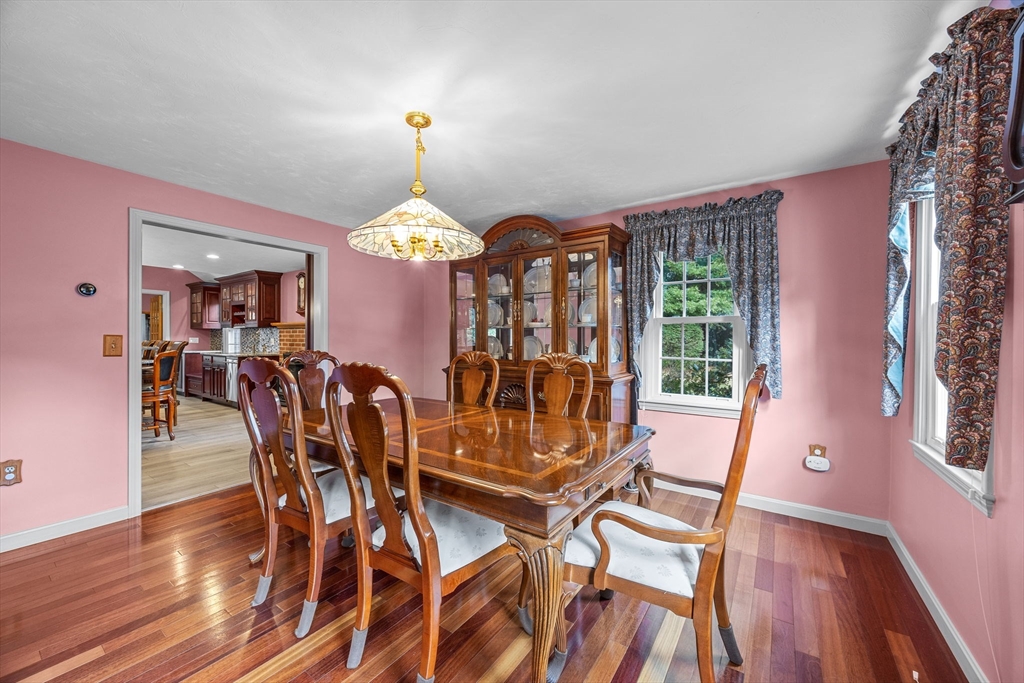 19 King Philip Path Mendon, MA 01756 - Photo 4 of 42 a view of a dining room with furniture window and wooden floor