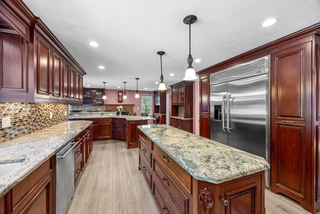 19 King Philip Path Mendon, MA 01756 - Photo 9 of 42 a kitchen with granite countertop counter top space a sink stainless steel appliances and cabinets