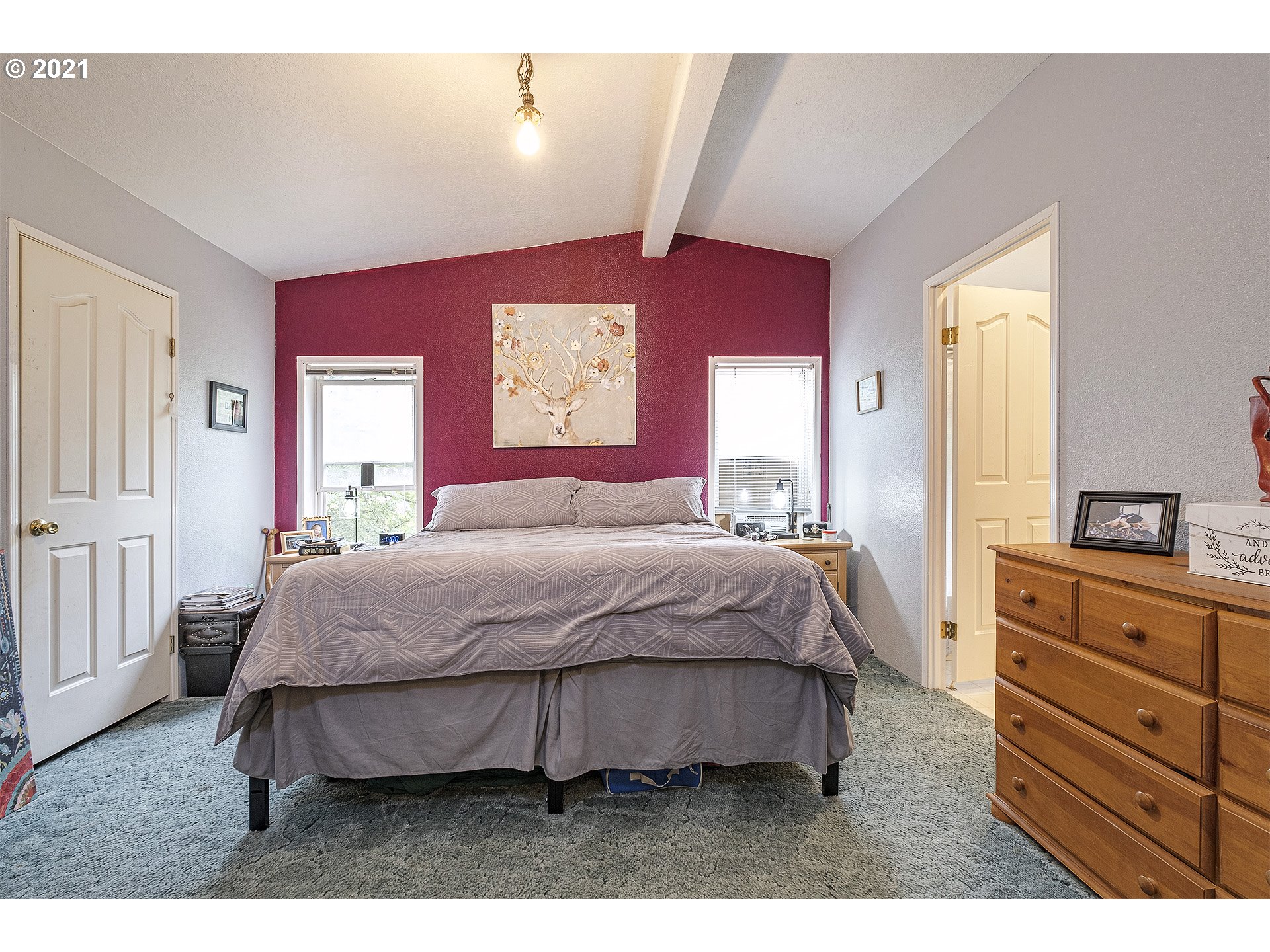 49213 Southwest Patton Valley Road Gaston, OR 97119 - Photo 14 of 32 a spacious bedroom with a bed and a dresser
