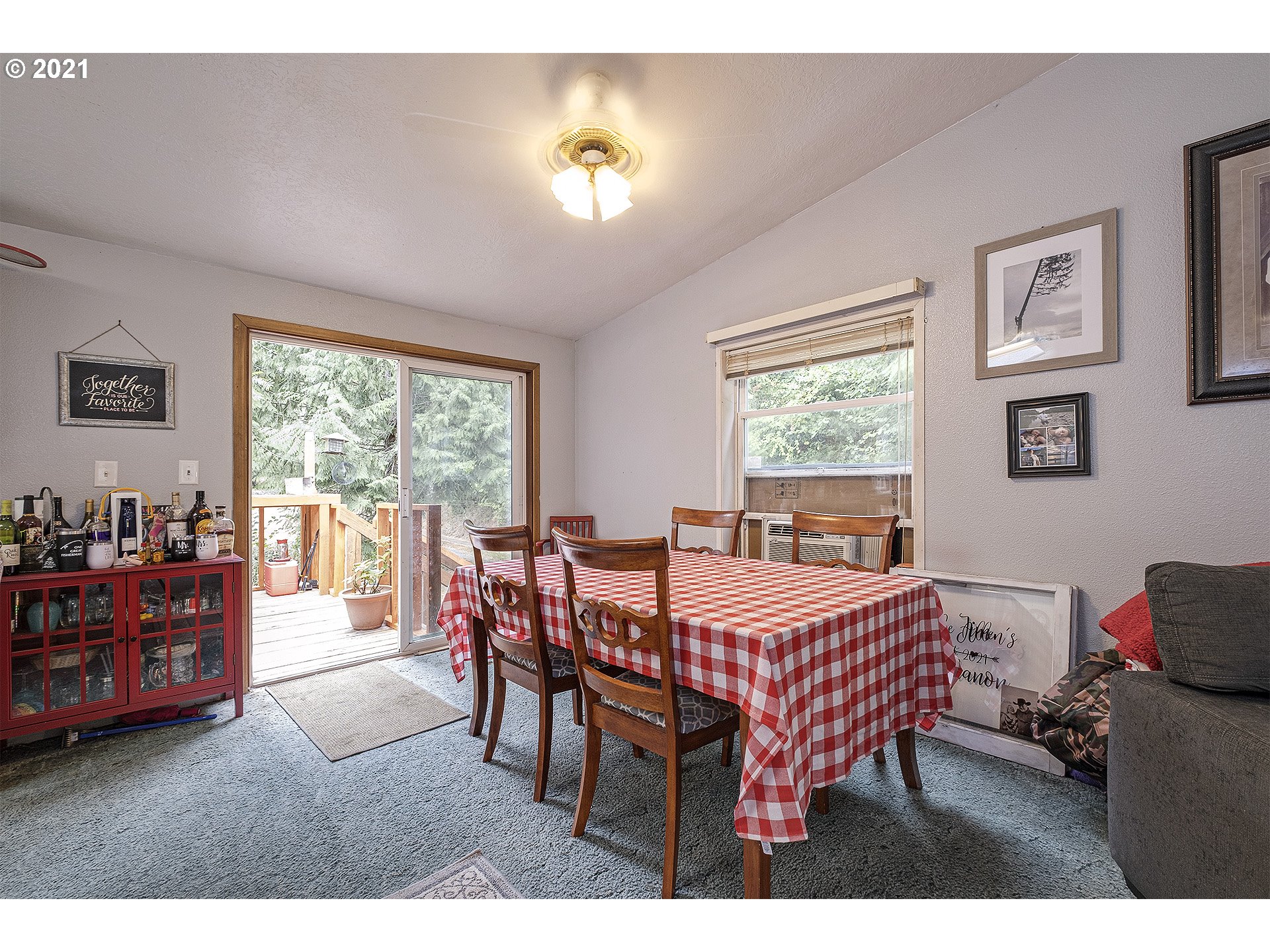 49213 Southwest Patton Valley Road Gaston, OR 97119 - Photo 8 of 32 a view of a dining room with furniture and a chandelier