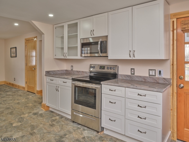 1387 Monmouth Road Eastampton, NJ 08060 - Photo 14 of 35 a kitchen with stainless steel appliances granite countertop a stove a sink and a microwave