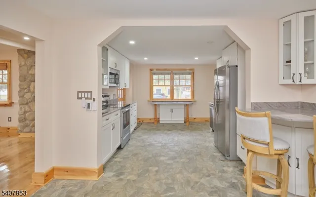 a living room with furniture and a table