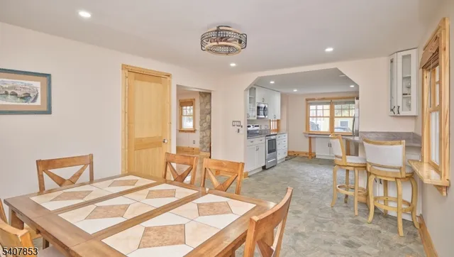 a dining room with furniture and window