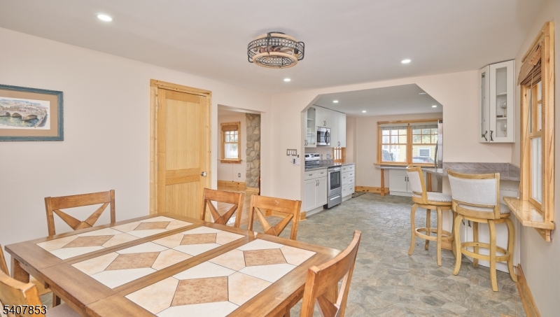 1387 Monmouth Road Eastampton, NJ 08060 - Photo 18 of 35 a living room with furniture and a table