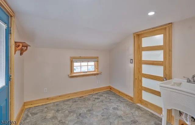 a bathroom with a shower a sink a toilet and a mirror