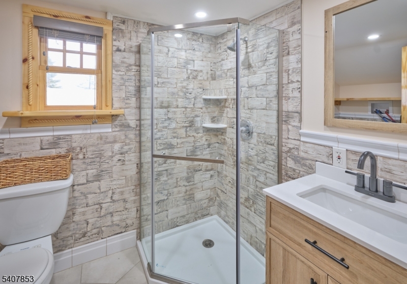 1387 Monmouth Road Eastampton, NJ 08060 - Photo 21 of 35 a bathroom with a shower a sink a toilet and a mirror