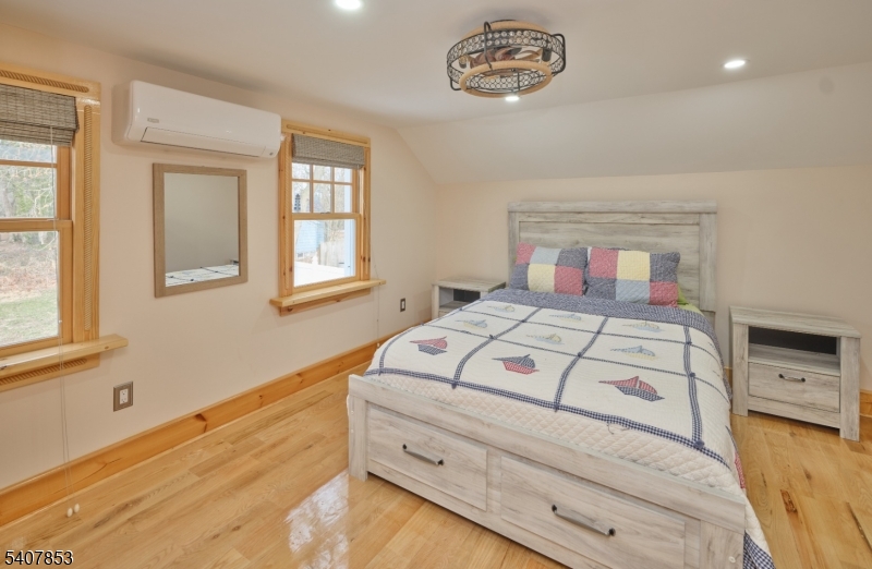 1387 Monmouth Road Eastampton, NJ 08060 - Photo 31 of 35 a bedroom with a bed and a window