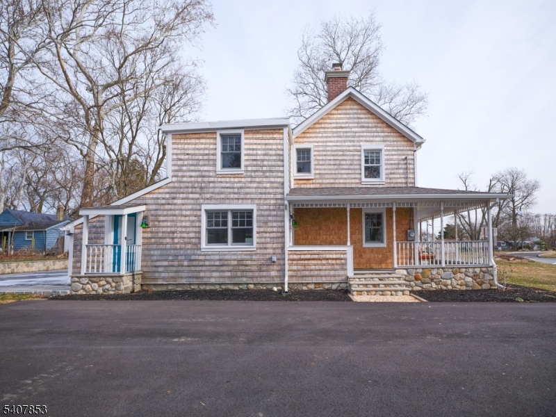 1387 Monmouth Road Eastampton, NJ 08060 - Photo 7 of 35 a front view of a house with a yard and garage