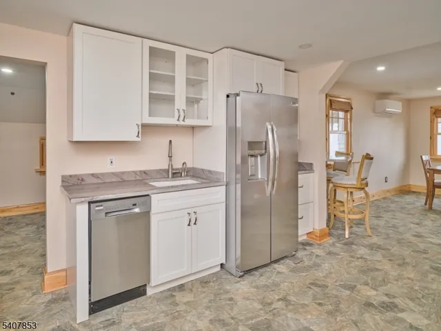 a kitchen with stainless steel appliances cabinets and a counter top space
