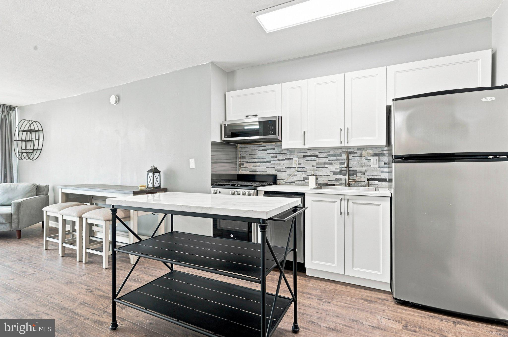 3900 West Ford Road, Unit 2J Philadelphia, PA 19131 - Photo 2 of 15 Updated kitchen with white cabinetry