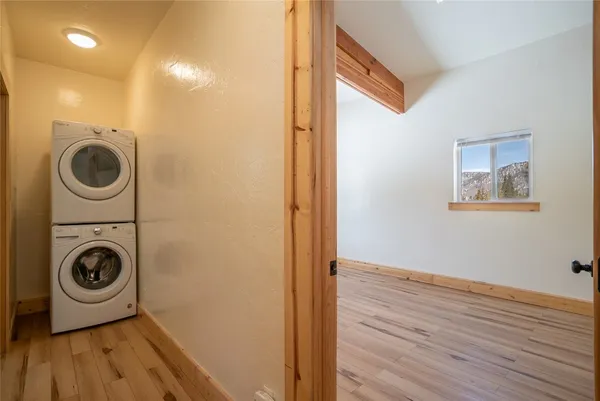 a view of a hallway with washer and dryer