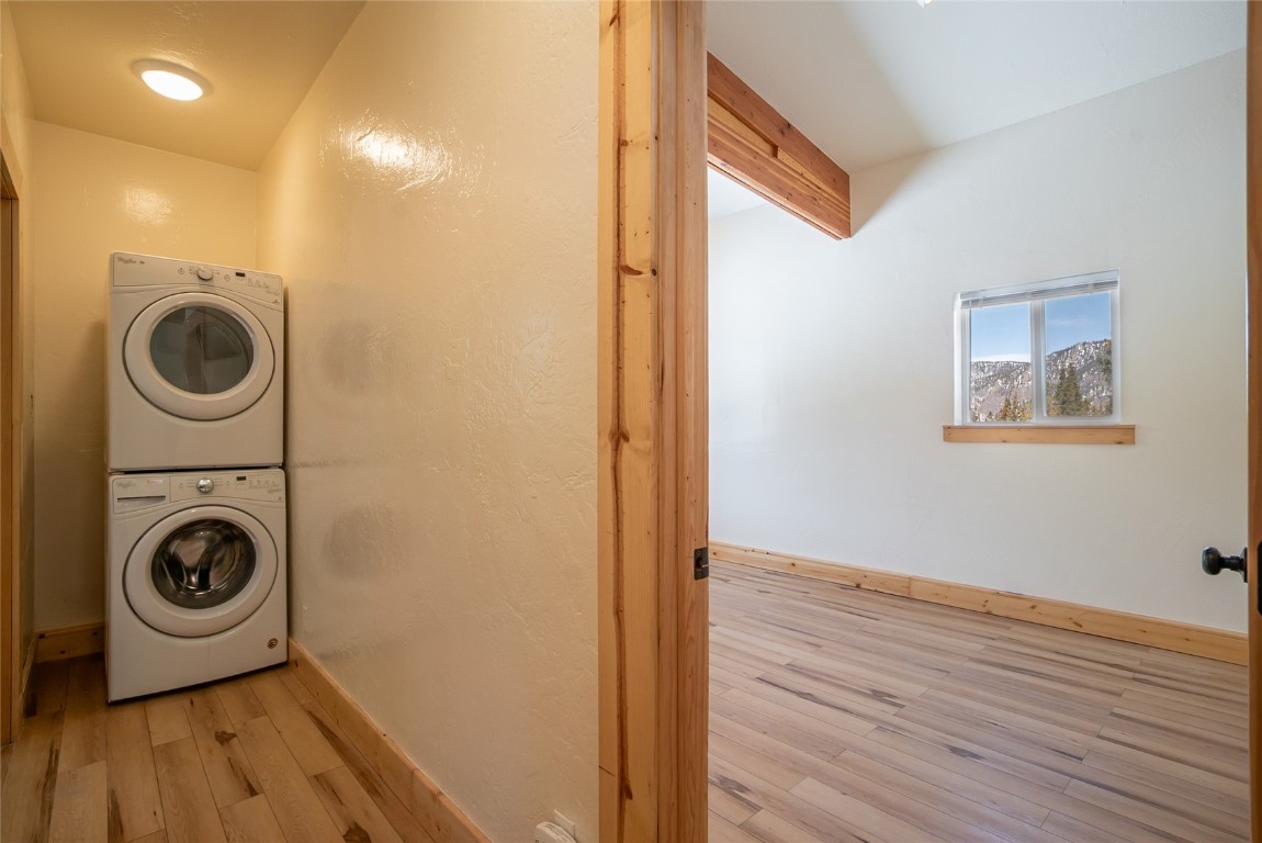 5277 Montezuma Road Montezuma, CO 80435 - Photo 18 of 30 a view of a hallway with washer and dryer