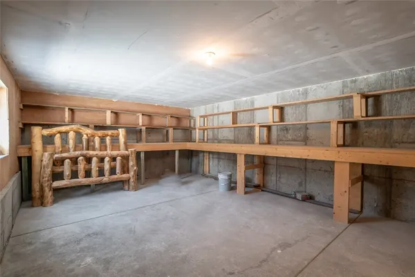 a view of an empty room with furniture