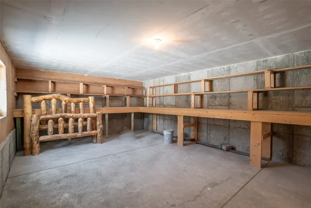 a view of an empty room with furniture