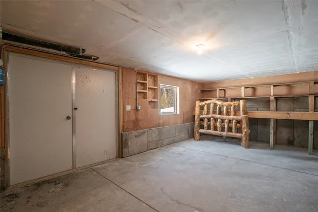 a view of an empty room with a fireplace