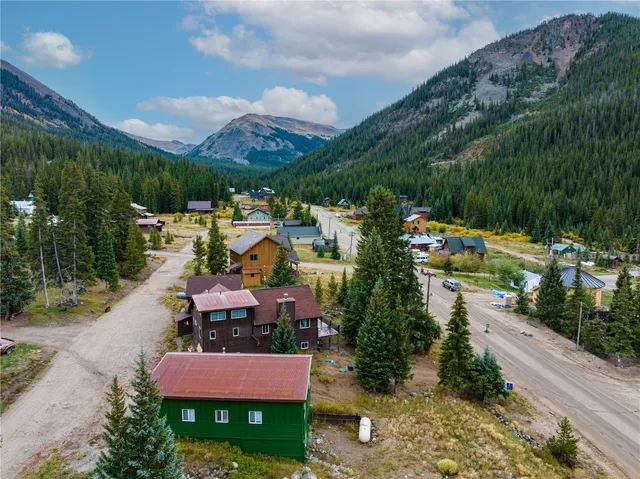 a view of a house with a yard and garden