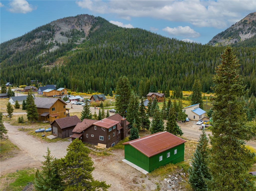 5277 Montezuma Road Montezuma, CO 80435 - Photo 29 of 30 a view of a house with a garden and lake view