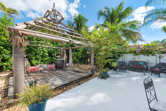 a view of a chair and table in the patio