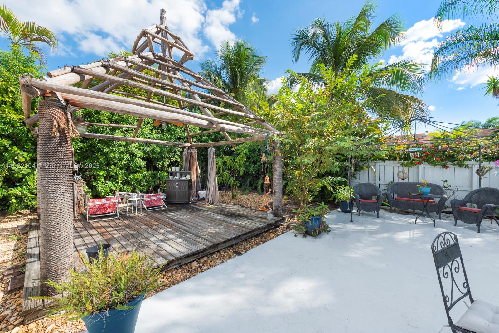 11724 Southwest 95th Street Miami, FL 33186 - Photo 22 of 25 a view of a chair and table in the patio