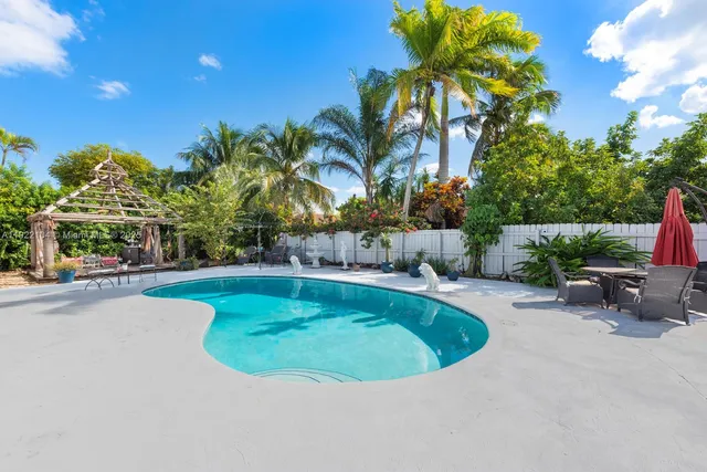 a view of a swimming pool with a patio