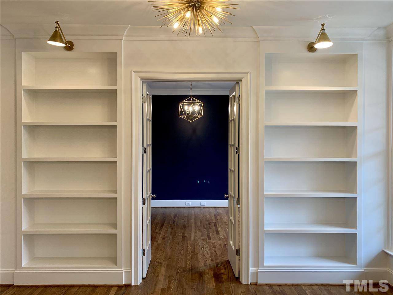 2723 Anderson Drive Raleigh, NC 27608 - Photo 1 of 2 a view of an entryway with a fireplace