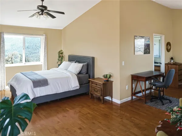 a bedroom with a bed and a table