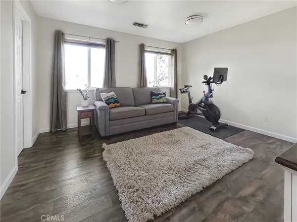a living room with furniture and a rug