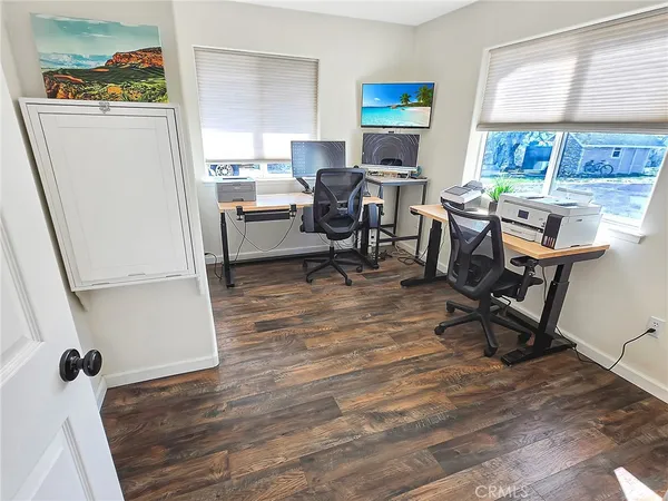 a workspace with furniture hardwood and a window