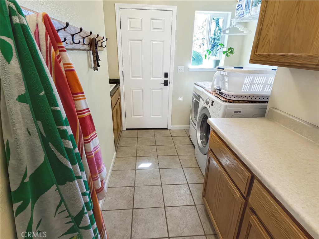 6097 Sherlock Road Midpines, CA 95345 - Photo 22 of 37 a bathroom with a sink a toilet and a shower