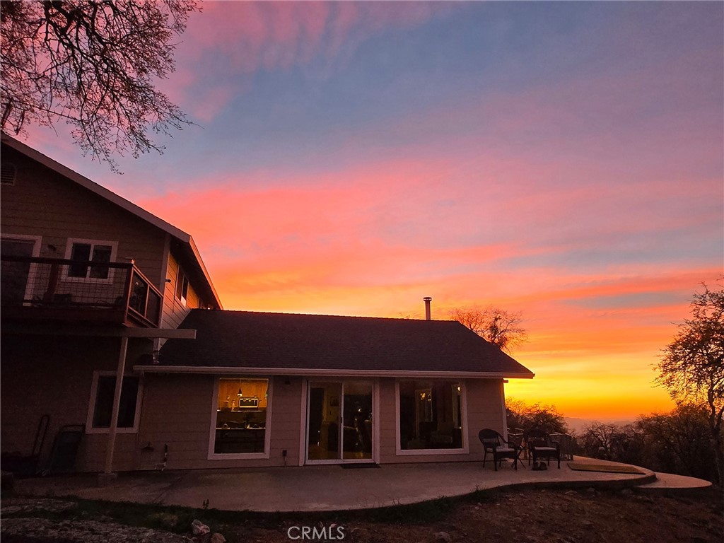 6097 Sherlock Road Midpines, CA 95345 - Photo 30 of 37 a front view of a house with a yard