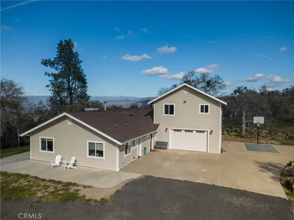a view of a house with a house in the background